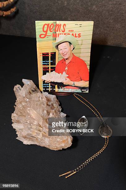 From the former Roy Rogers Museum in Branson, Missouri, a large smoky Arkansas quartz , a fire agate gold ring and a bolo tie with an agatized coral...