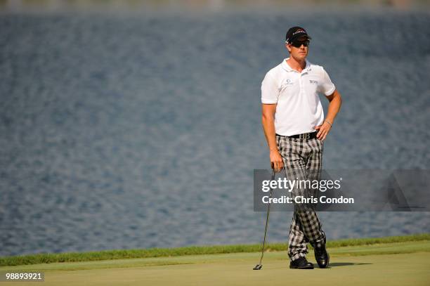 Henrik Stenson of Sweden waits to putt during the first round of THE PLAYERS Championship on THE PLAYERS Stadium Course at TPC Sawgrass on May 6,...