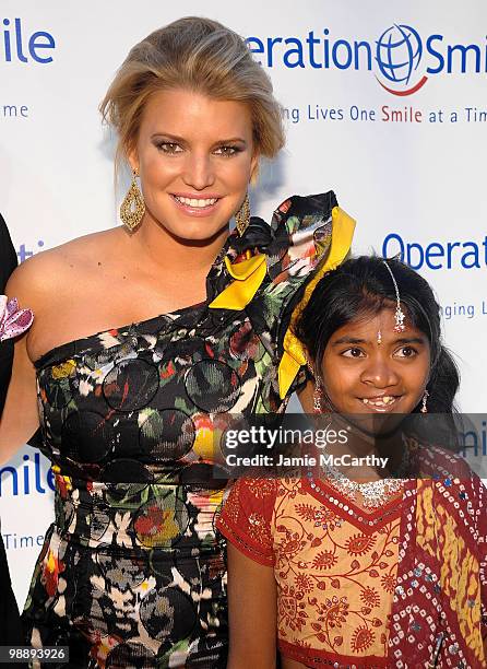 Jessica Simpson and Operation Smile patient Meena walk the red carpet during the Operation Smile Annual Gala at Cipriani, Wall Street on May 6, 2010...