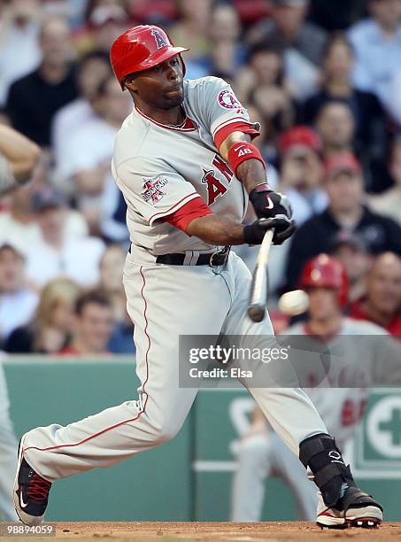 Torii Hunter of the Los Angeles Angels of Anaheim hits an RBI single in the first inning against the Boston Red Sox on May 6, 2010 at Fenway Park in...