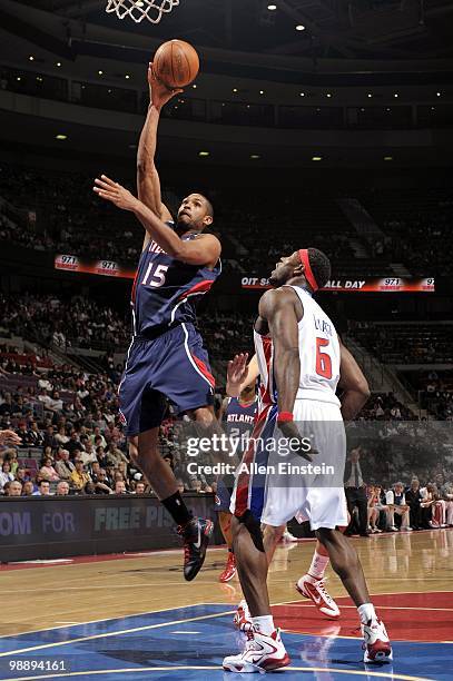 Al Horford of the Atlanta Hawks makes a layup against Ben Wallace of the Detroit Pistons during the game at the Palace of Auburn Hills on April 7,...