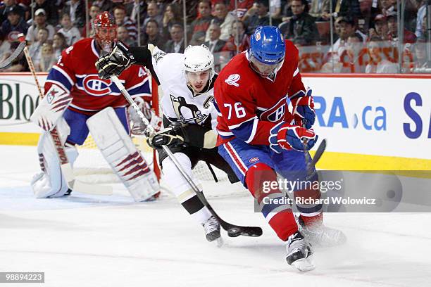 Sidney Crosby of the Pittsburgh Penguins and P.K. Subban of the Montreal Canadiens battle for the puck in Game Four of the Eastern Conference...