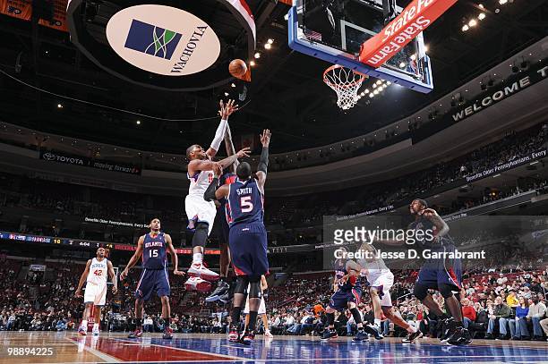 Marreese Speights of the Philadelphia 76ers puts a shot up against Josh Smith of the Atlanta Hawks during the game on March 26, 2010 at the Wachovia...
