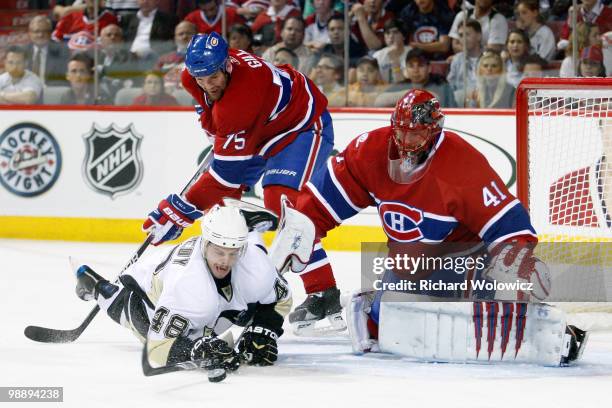 Tyler Kennedy of the Pittsburgh Penguins takes a shot lying down on Jaroslav Halak of the Montreal Canadiens in Game Four of the Eastern Conference...