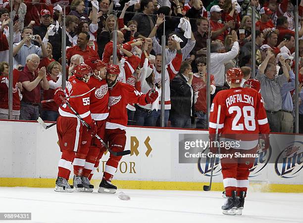 Johan Franzen of the Detroit Red Wings celebrates his third goal of the first period with Niklas Kronwall, Todd Bertuzzi and Brian Rafalski while...