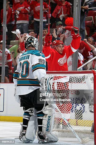 Valtteri Filppula of the Detroit Red Wings raises his stick to celebrate his goal on Evgeni Nabokov of the San Jose Sharks during Game Four of the...