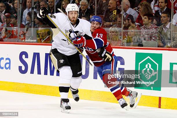 Mike Cammalleri of the Montreal Canadiens and Brooks Orpik of the Pittsburgh Penguins collide in Game Four of the Eastern Conference Semifinals...