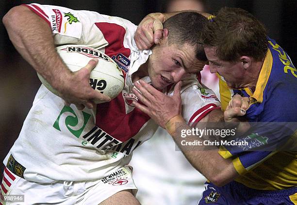 Wayne Bartrim of the Dragons is tackled by Jason taylor of the Eels during the round 22 NRL match between the Parramatta Eels and the St...