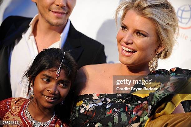 Singer Jessica Simpson and Operation Smile patient Meena attend the 2010 Operation Smile annual gala at Cipriani, Wall Street on May 6, 2010 in New...