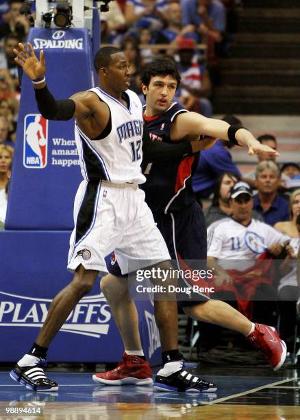 Zaza Pachulia of the Atlanta Hawks battles for position with Dwight Howard of the Orlando Magic in Game Two of the Eastern Conference Semifinals...