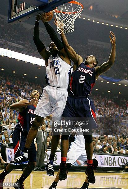 Dwight Howard of the Orlando Magic grabs a rebound over Joe Johnson of the Atlanta Hawks in Game Two of the Eastern Conference Semifinals during the...