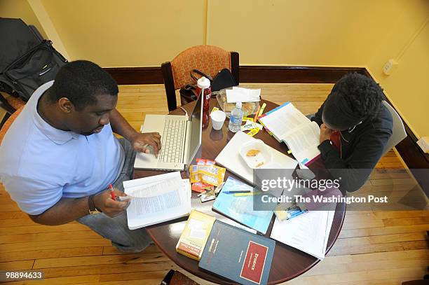 Jelani Freeman of Alexandria, Virginia, studies for his final law exam with Yaa Aba Acquaah of Valdosta, Georgia, at Howard University Law School in...