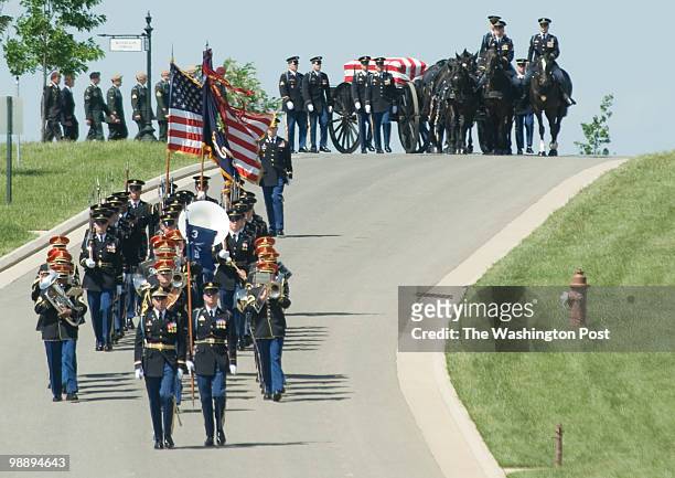 The caisson makes its way to the burial site. Burial service for Operation Iraqi Freedom casualty Staff Sgt. James R. Patton of Fort Benning, Ga.,...