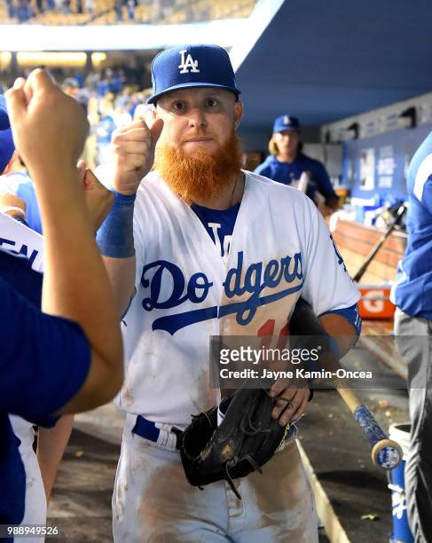 Justin Turner of the Los Angeles Dodgers leaves the dugout after defeating the Chicago Cubs at Dodger Stadium on June 27, 2018 in Los Angeles,...