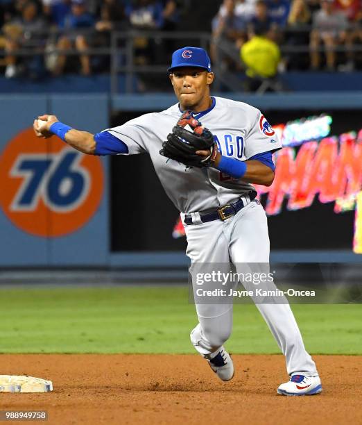 Addison Russell of the Chicago Cubs makes a play in the game against the Los Angeles Dodgers at Dodger Stadium on June 27, 2018 in Los Angeles,...