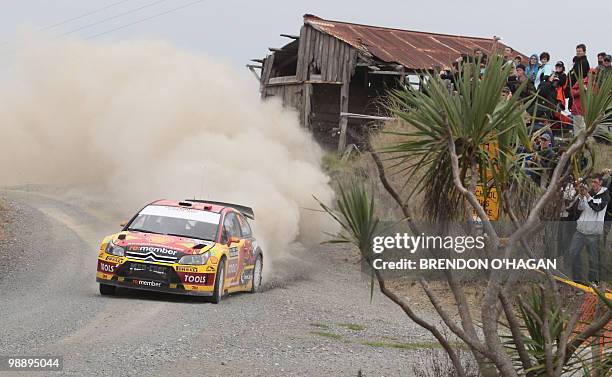 Citroen C4 driver Petter Solberg of Norway and co-driver Phil Mills of Britain slide in a corner during day 1 of the rally of New Zealand in Auckland...