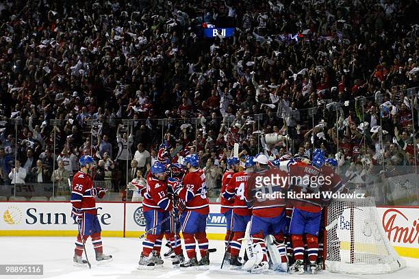 Members of the Montreal Canadiens celebrate their 3-2 victory over the Pittsburgh Penguins in Game Four of the Eastern Conference Semifinals during...