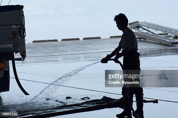 fishing port - industrial hose stockfoto's en -beelden