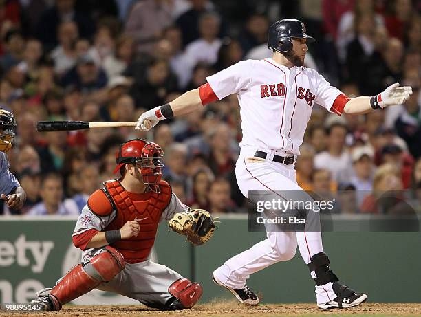 Jeremy Hermida of the Boston Red Sox gets a 2RBI hit as Mike Napoli of the Los Angeles Angels of Anaheim defends on May 6, 2010 at Fenway Park in...