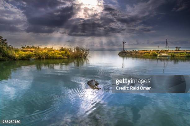 sunlight shining through clouds - dawn raid stock pictures, royalty-free photos & images