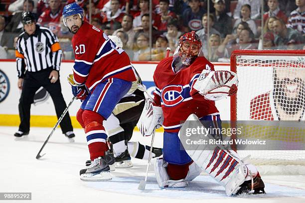 Jaroslav Halak of the Montreal Canadiens makes a glove on the puck in the third period of Game Four of the Eastern Conference Semifinals against the...