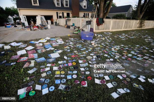 Vinyl records and CD's lay out to dry outside a flooded home in the Cottonwood community on May 6, 2010 in Franklin, Tennessee. Massive rainstorms...