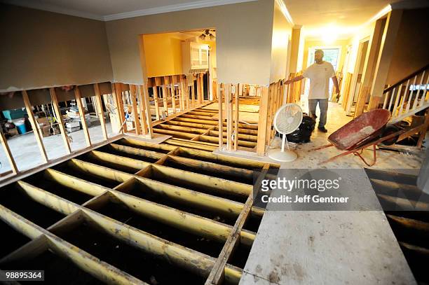 Rick Schipper of Iowa turns the lights on at his sister-in-law's flooded home in the Cottonwood sub-division on May 6, 2010 in Franklin, Tennessee....