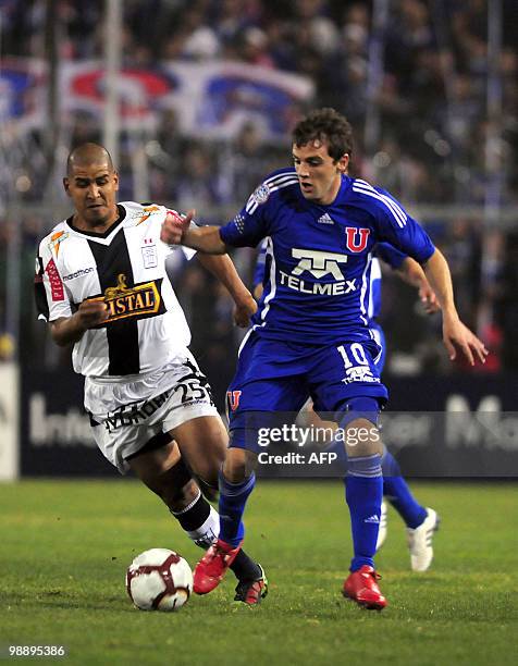 Universidad de Chile's Walter Montillo vies for the ball with Alianza de Lima's Edgar Gonzalez during their Copa Libertadores 2010 football match in...