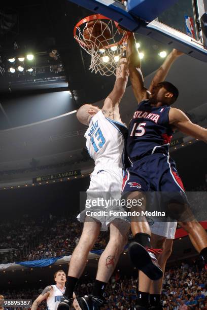 Al Horford of the Atlanta Hawks dunks against Marcin Gortat of the Orlando Magic in Game Two of the Eastern Conference Semifinals during the 2010 NBA...