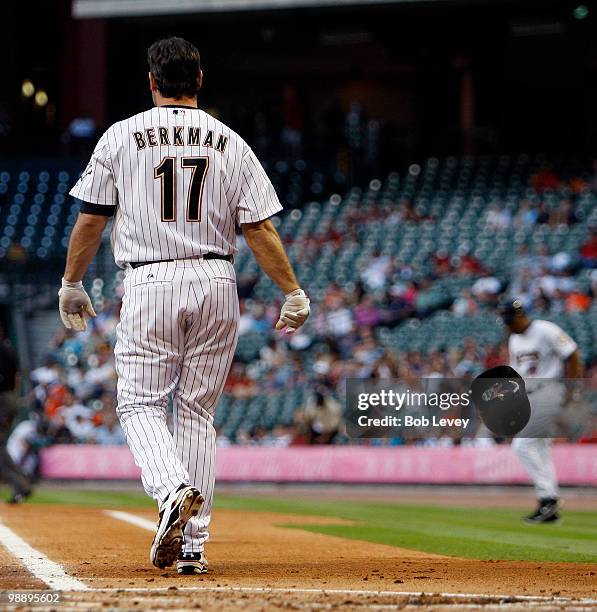 Lance Berkman of the Houston Astros tosses his helmet after striking out against the Arizona Diamondbacks in the first inning at Minute Maid Park on...