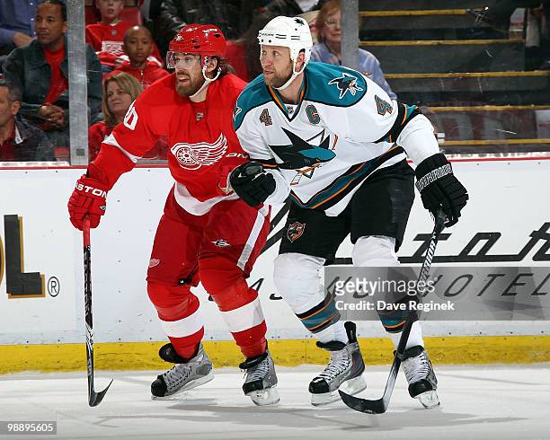 Rob Blake of the San Jose Sharks and Henrik Zetterberg of the Detroit Red Wings watch for the puck during Game Four of the Western Conference...
