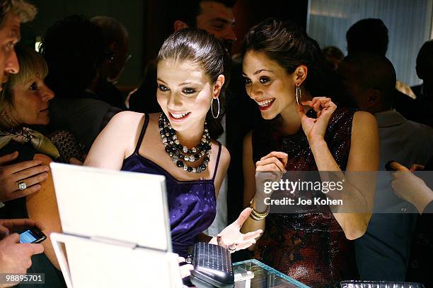 Actresses Michelle Trachtenberg and Emmy Rossum attend the 30th Anniversary celebration cocktail reception with Rebirth of NYC Flagship hosted by...