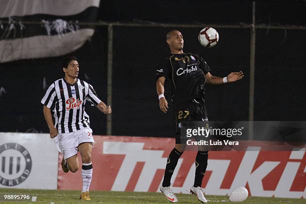 Carlos Johnson of Once Caldas fights for the ball with Rodolfo Gamarra of Libertad during a match as part of the Libertadores Cup 2010 at Defensores...
