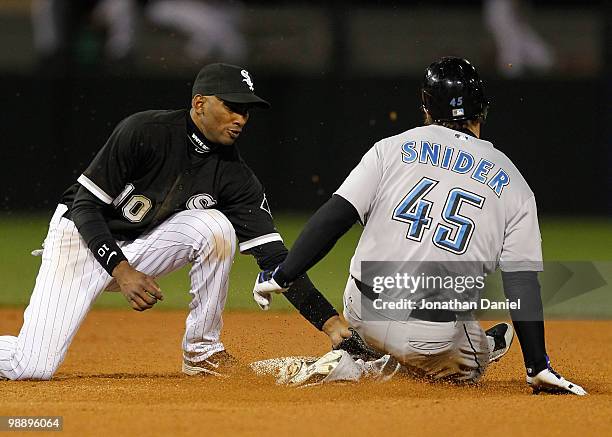 Alexei Ramirez of the Chicago White Sox tags out Travis Snider of the Toronto Blue Jays as he tries to steal at U.S. Cellular Field on May 6, 2010 in...