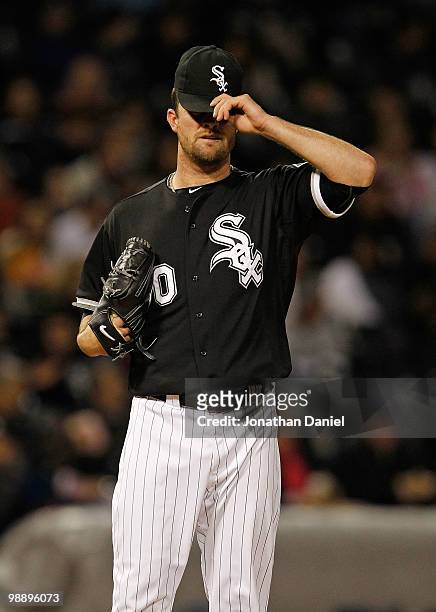 Starting pitcher John Danks of the Chicago White Sox reacts after the Toronto Blue Jays score two runs in the 5th inning at U.S. Cellular Field on...