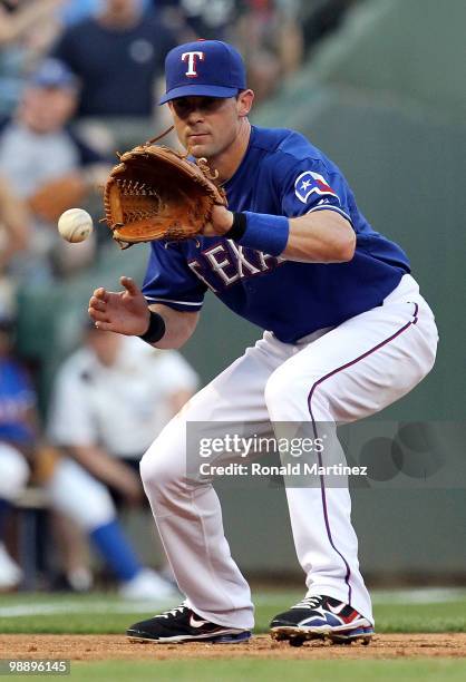 Third baseman Michael Young of the Texas Rangers fields the ball against the Kansas City Royals on May 6, 2010 at the Ballpark in Arlington, Texas.