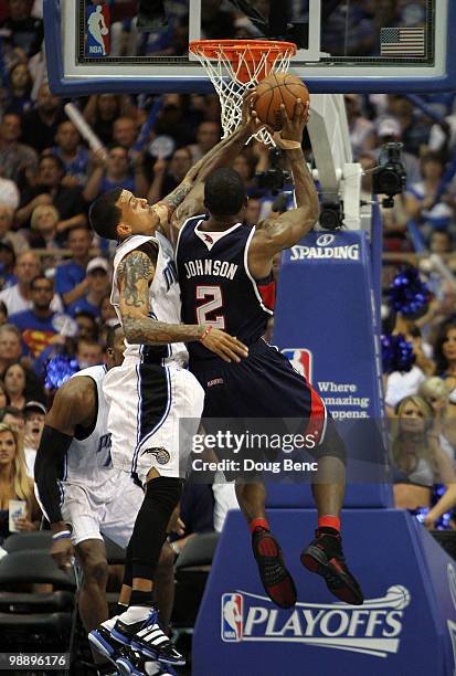 Joe Johnson of the Atlanta Hawks shoots over Matt Barnes of the Orlando Magic in Game Two of the Eastern Conference Semifinals during the 2010 NBA...