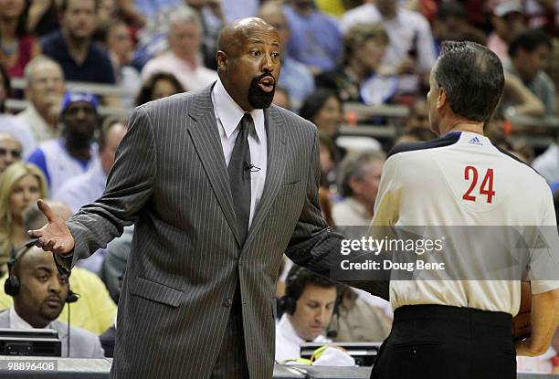 Head coach Mike Woodson of the Atlanta Hawks protests to official Mike Callahan while facing the Orlando Magic in Game Two of the Eastern Conference...