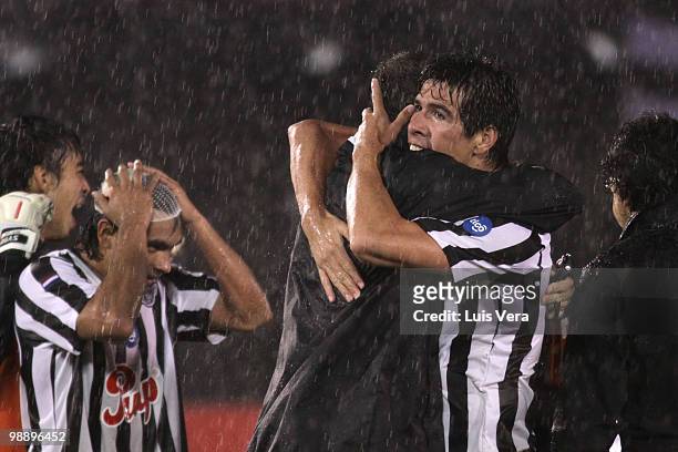 Victor Caceres and Manuel Maciel of Libertad celebrate victory over Once Caldas during a match as part of the Libertadores Cup 2010 at Defensores del...