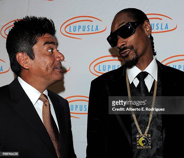 Comedian George Lopez and rapper Snoop Dogg arrive at the 10th Annual Lupus LA Orange Ball on May 6, 2010 in Beverly Hills, California.