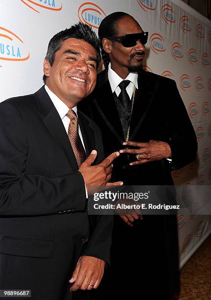 Comedian George Lopez and rapper Snoop Dogg arrive at the 10th Annual Lupus LA Orange Ball on May 6, 2010 in Beverly Hills, California.