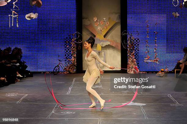 Model showcases her gymnastic moves on the catwalk during the Ms Unkon collection show on the fifth and final day of Rosemount Australian Fashion...