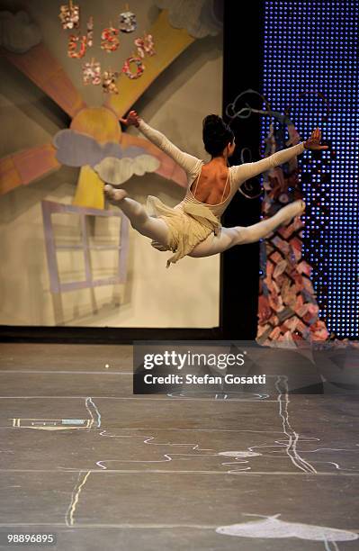 Model showcases her gymnastic moves on the catwalk during the Ms Unkon collection show on the fifth and final day of Rosemount Australian Fashion...