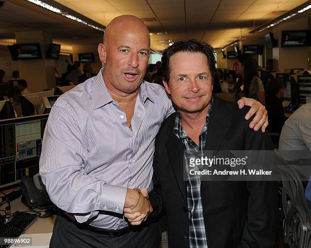 Co-founder Steven Starker and Michael J. Fox attend the 8th Annual Commissions for Charity Day at BTIG on May 6, 2010 in New York City.