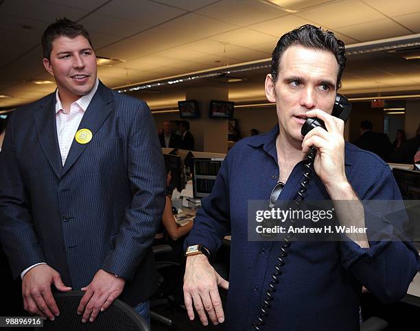 David Diehl and actor Matt Dillon work the phone at the 8th Annual Commissions for Charity Day at BTIG on May 6, 2010 in New York City.