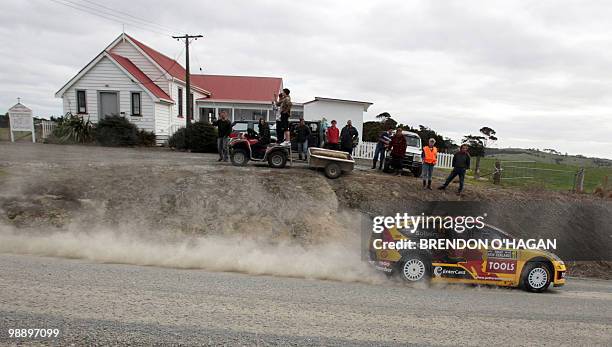 Petter Solberg's Citroen C4 driver Petter Solberg of Norway and co driver Phil Mills of Britain drive during day 1 of the rally of New Zealand in...