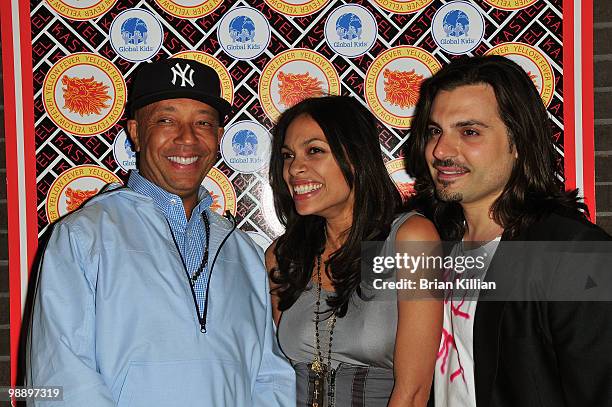 Russell Simmons, Rosario Dawson and Jamison Ernest attend Rosario Dawson's birthday party at Trump SoHo on May 6, 2010 in New York City.