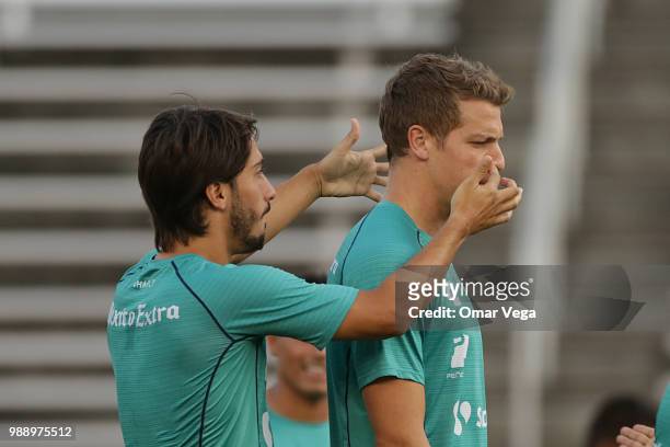Jose Javier Abella and Julio Furch of Club Santos warm up during a training session at Cotton Bowl on June 29, 2018 in Dallas, Texas.