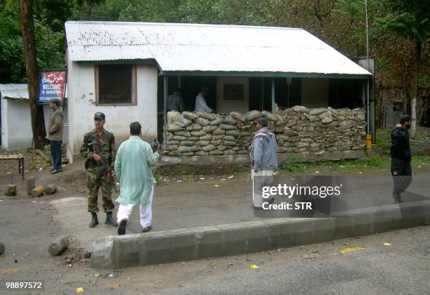 Pakistani police inspect a security checkpost after an attack by gunmen in Mansehra on May 7, 2010. Gunmen attacked a police checkpoint in northwest...