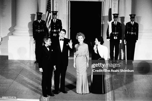 Crown Prince Akihito and Crown Princess Michiko are welcomed by U.S. President Ronald Reagan and his wife Nancy prior to their dinner at the White...